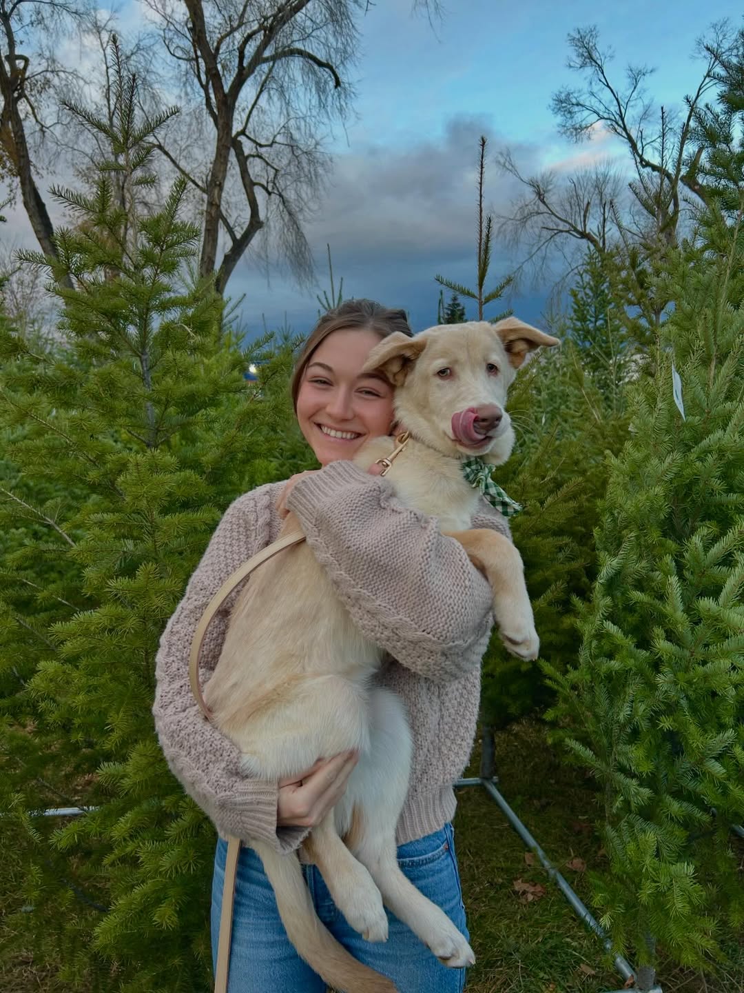 woman holding a puppy