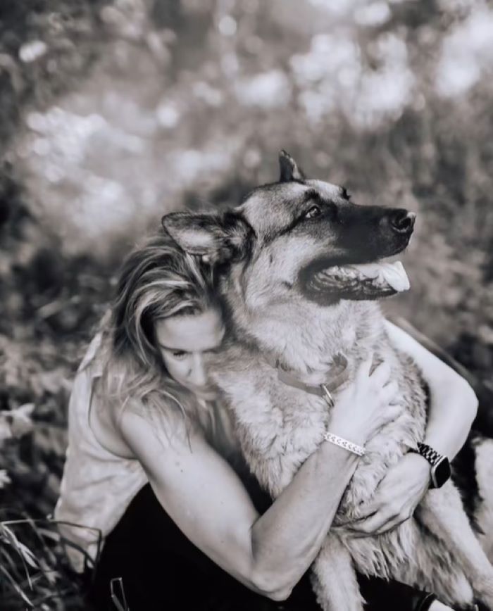 woman hugging a dog