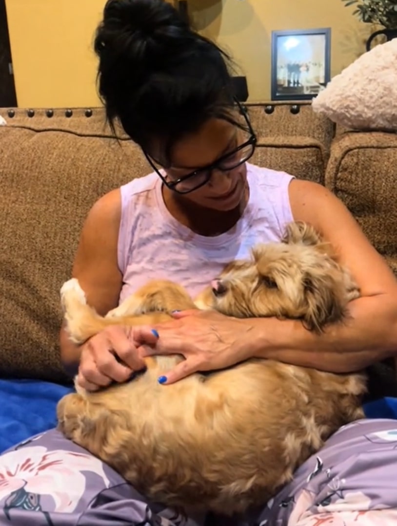 woman playing with dog