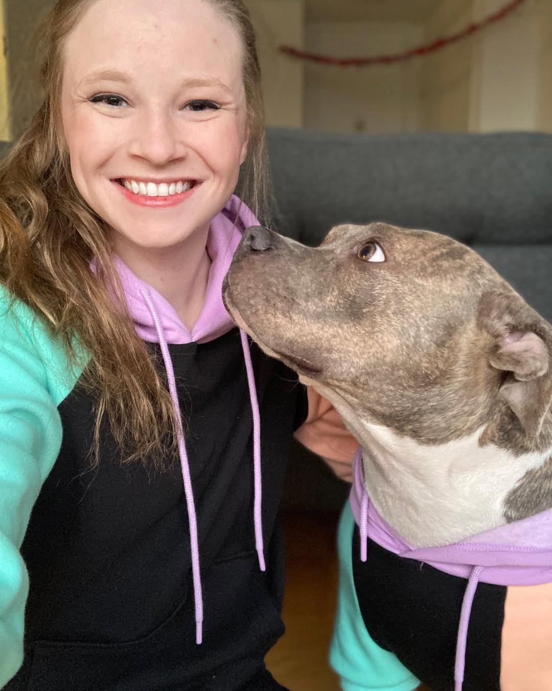 womana and sweet dog in house