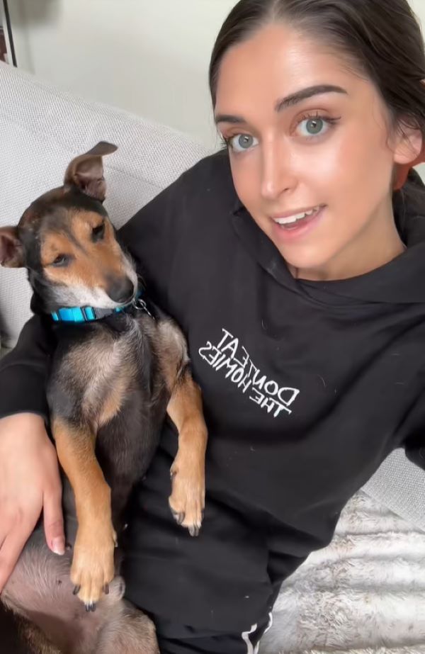 young woman with black dog