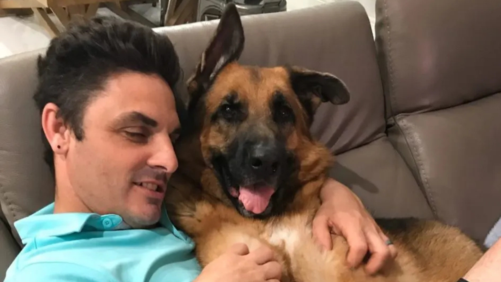 dog and man snuggling