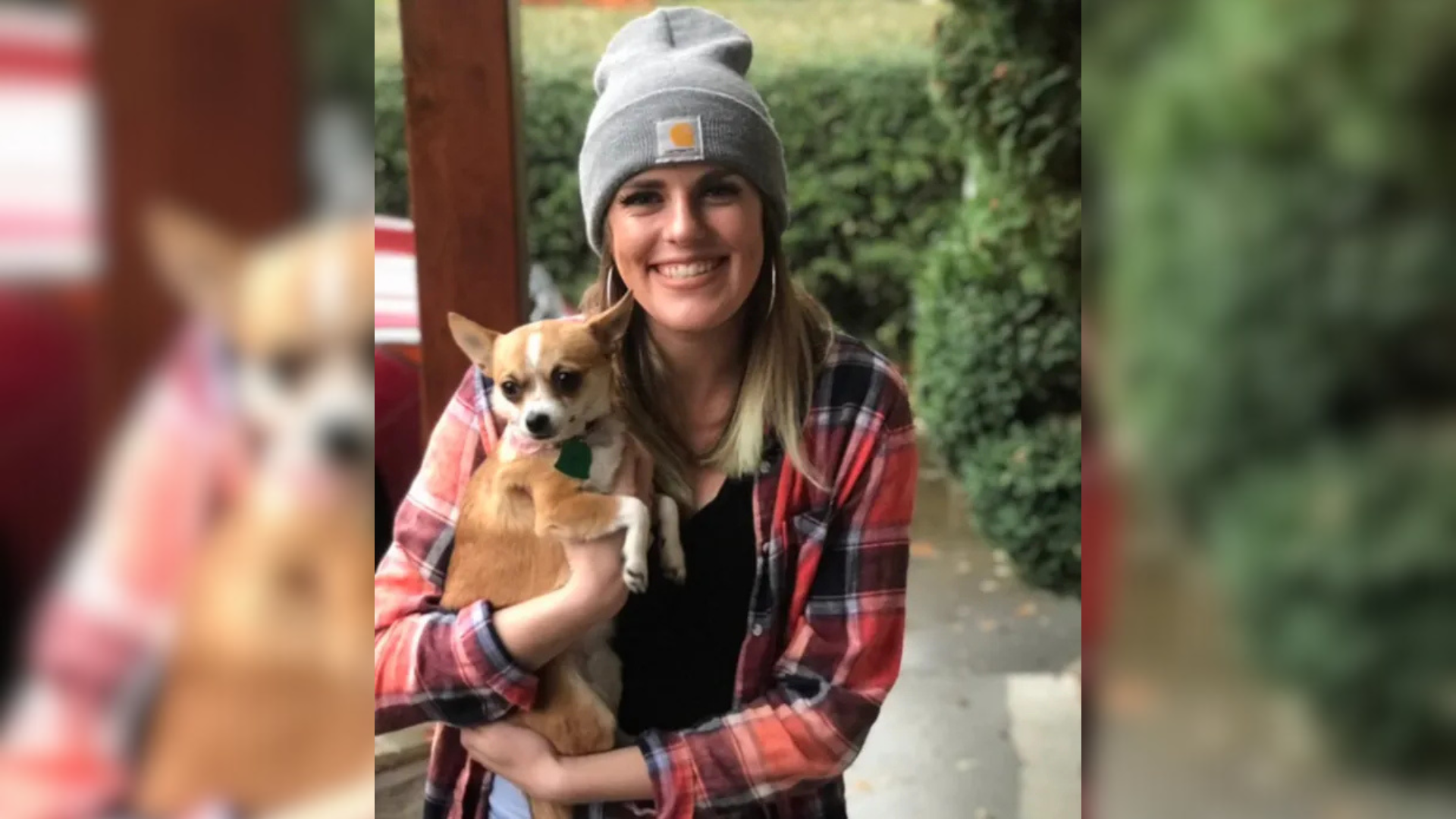 woman holding small dog