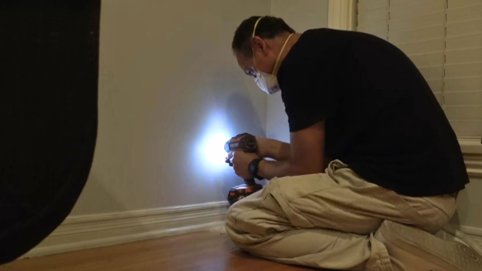man drilling wall