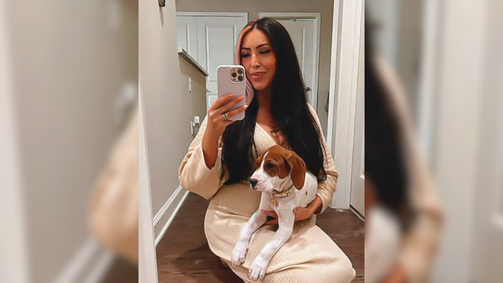 woman with dog taking selfie