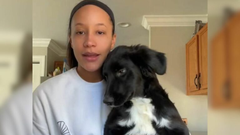 woman and black dog