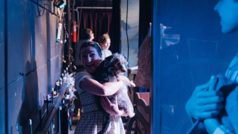 woman holding dog