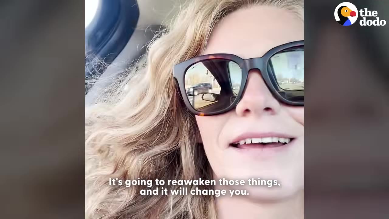 A close-up shot of Joanna smiling and talking while wearing sunglasses in a car.