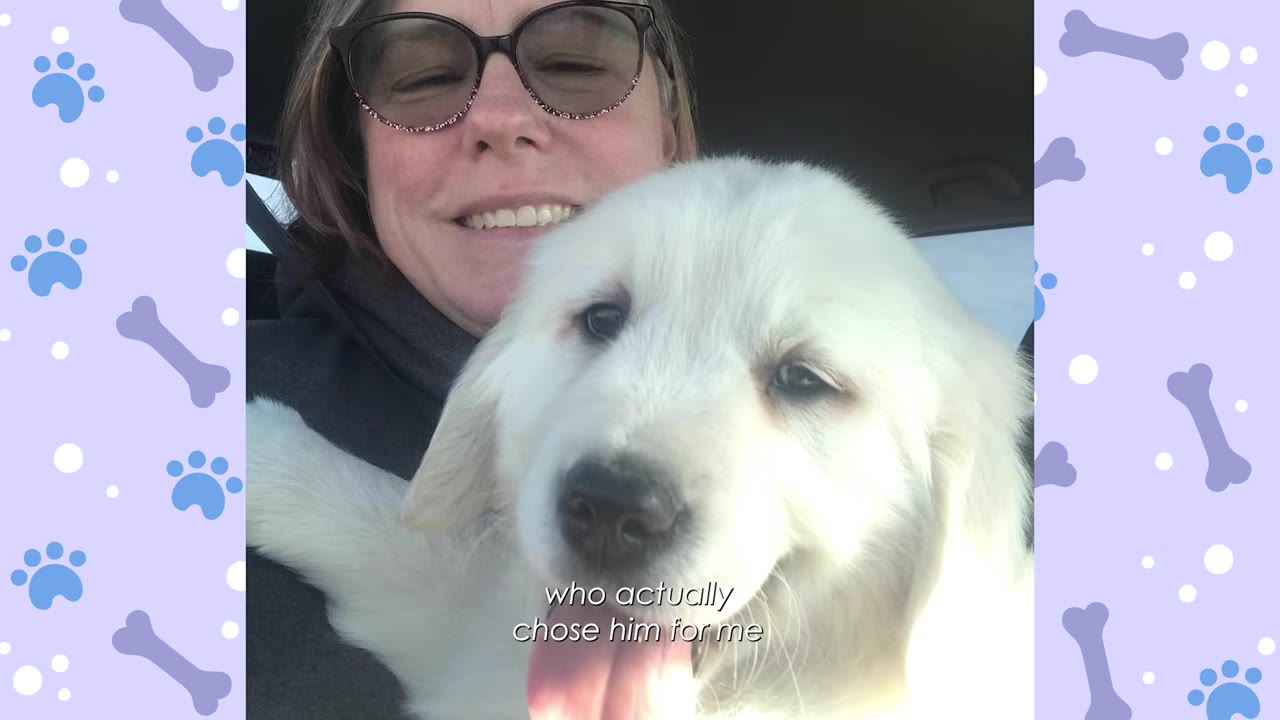 A close-up selfie of a smiling woman with glasses holding a fluffy white puppy close to her face.